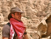 Indiana Jonesy tourist hiking in the mountains of Beidah near Petra, Jordan