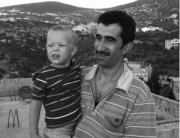 Jordanian man carrying an American boy