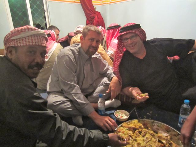 Eating mansaf in a home Petra Jordan Tour