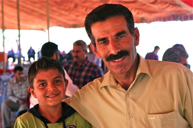 Mustachioed Arab man with son - Jordan tour