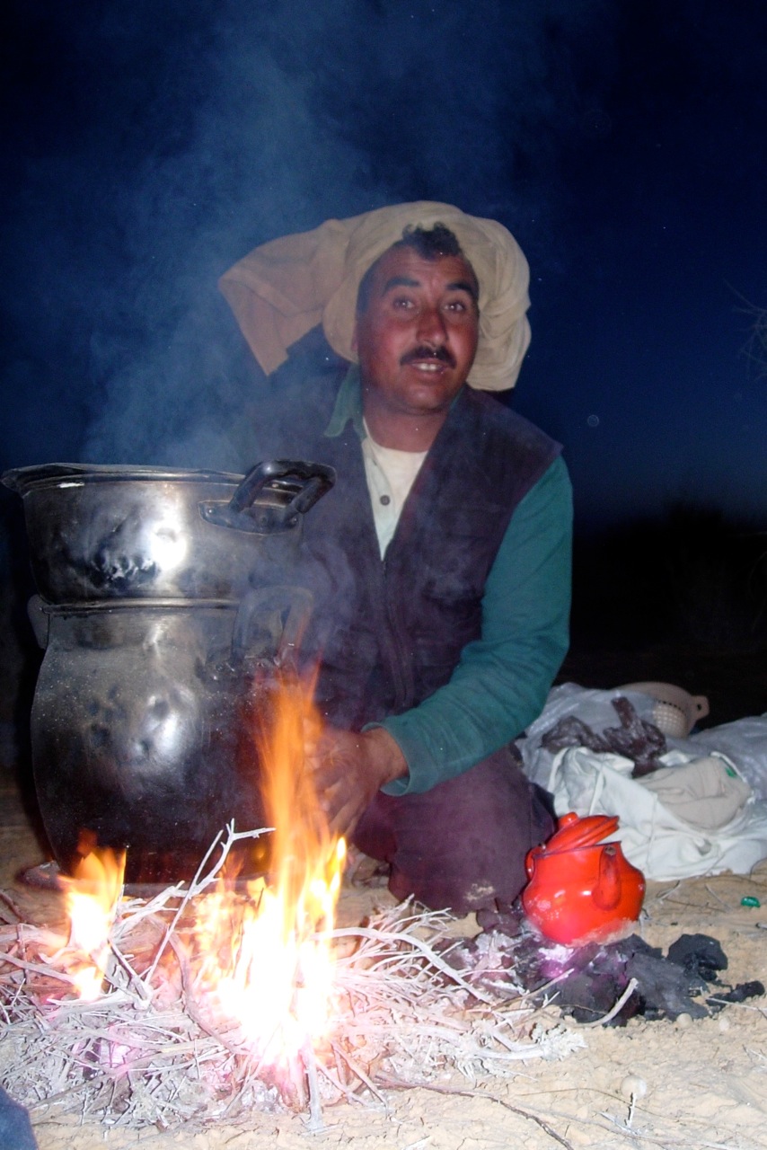 Cooking over an open fire with a Sahara Desert Guide