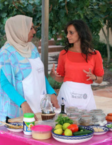 Participant talks with chef at Beit Sitti
